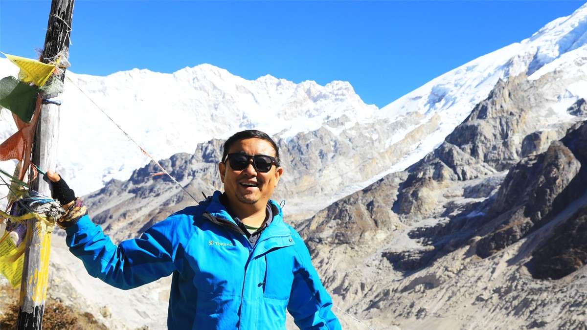Happy trekker with wide smile in Kanchenjunga South Base Camp