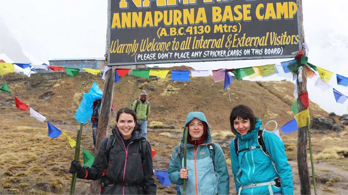 Foreign trekkers with smile of achivement at the Annapurna Base Camp