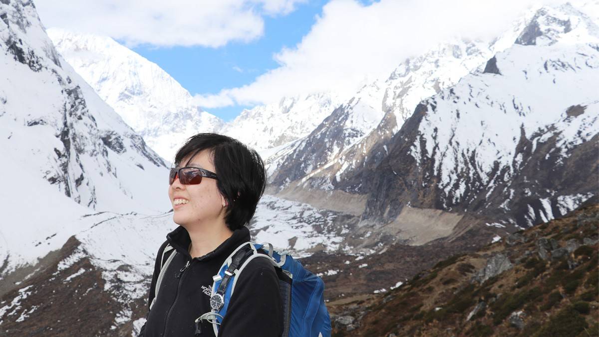 Manaslu Circuit Trekker enjoying snow clad mountain