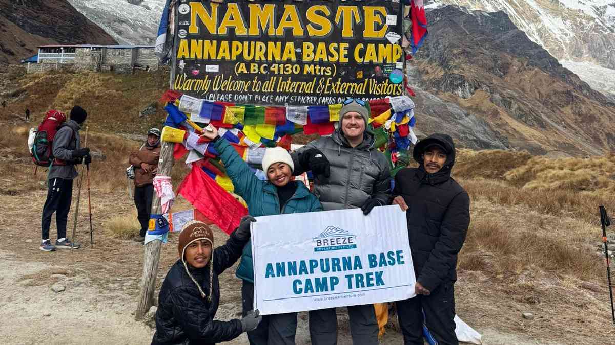 Breeze Adventure Team holding company banner in Annapurna Base Camp