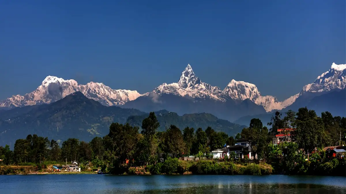 Machhapuchhre and the Annapurna range reflected above a lake in Pokhara