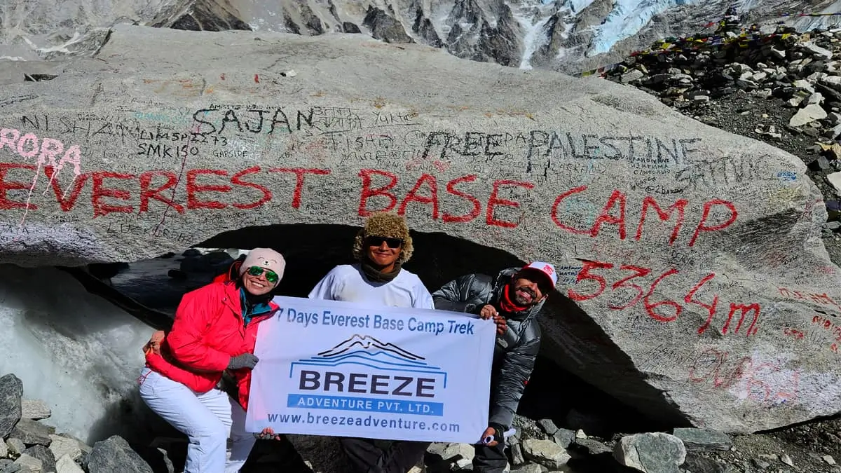 Trekkers at Everest Base Camp 5364m with Breeze Adventure Nepal banner