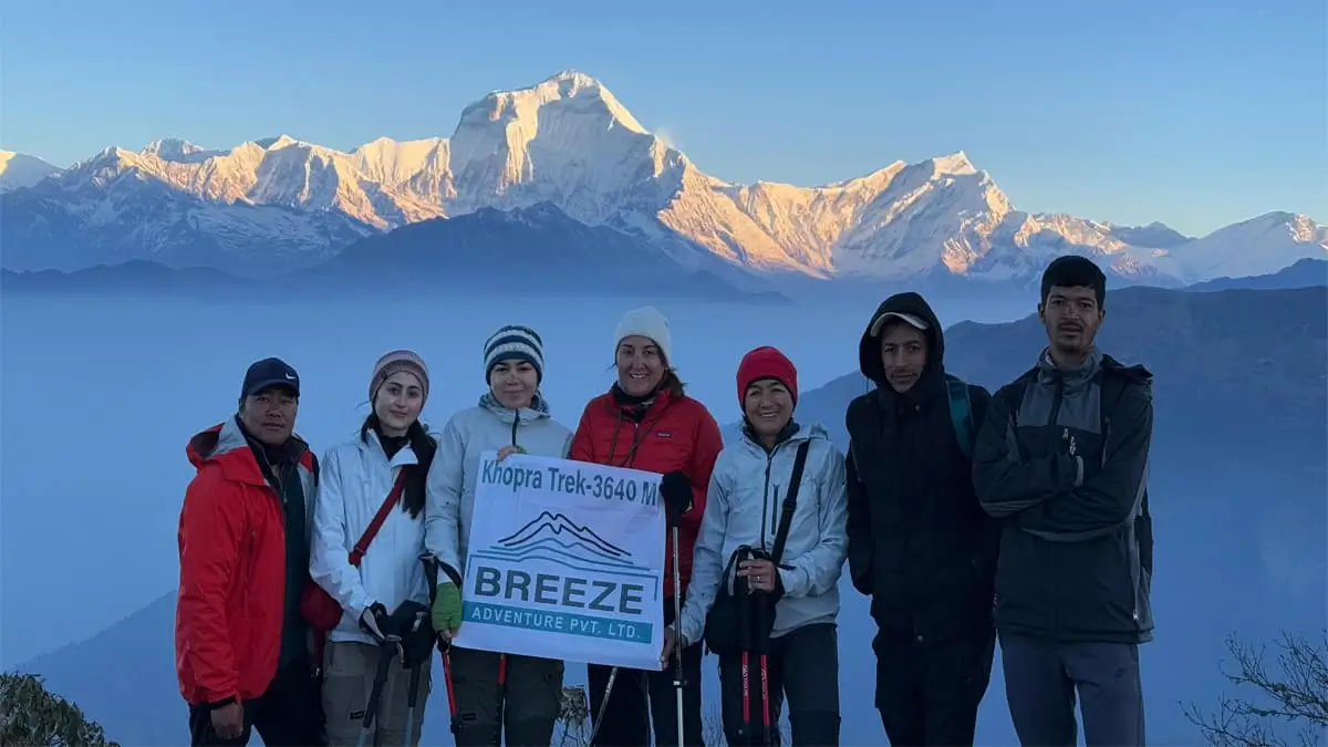 Breeze Adventure group at Khopra Danda 3640m with Dhaulagiri mountain sunrise Nepal