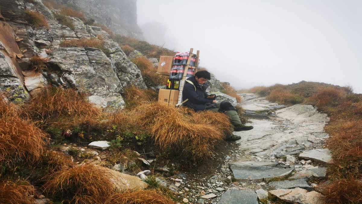 Porter carrying supplies up to teahouses on the Annapurna Base Camp trail