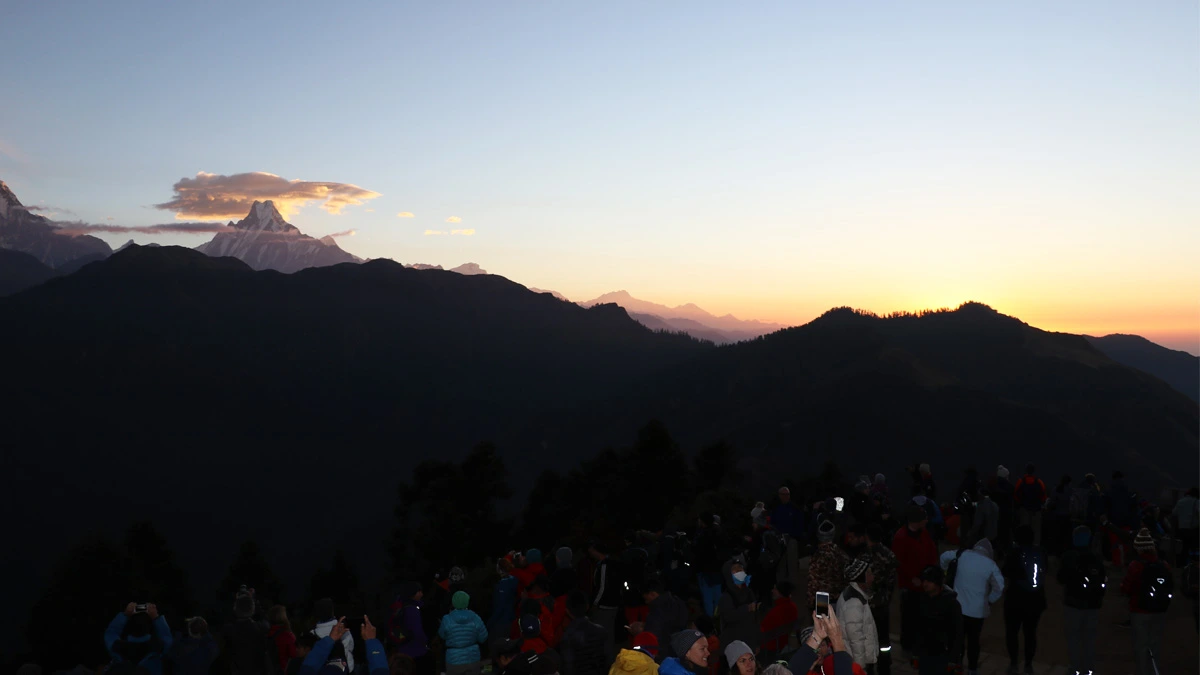 People enjoying sunrise views in Poon Hill