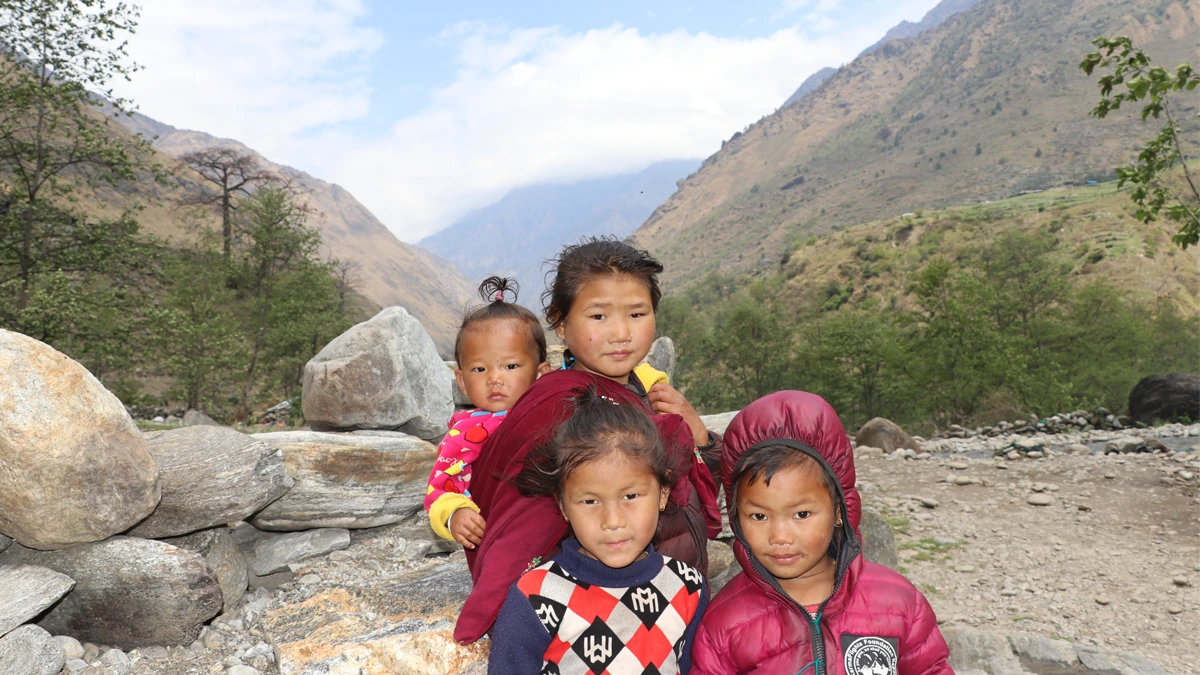 Local kids in traditional lifestyle in Himalayan trekking routes