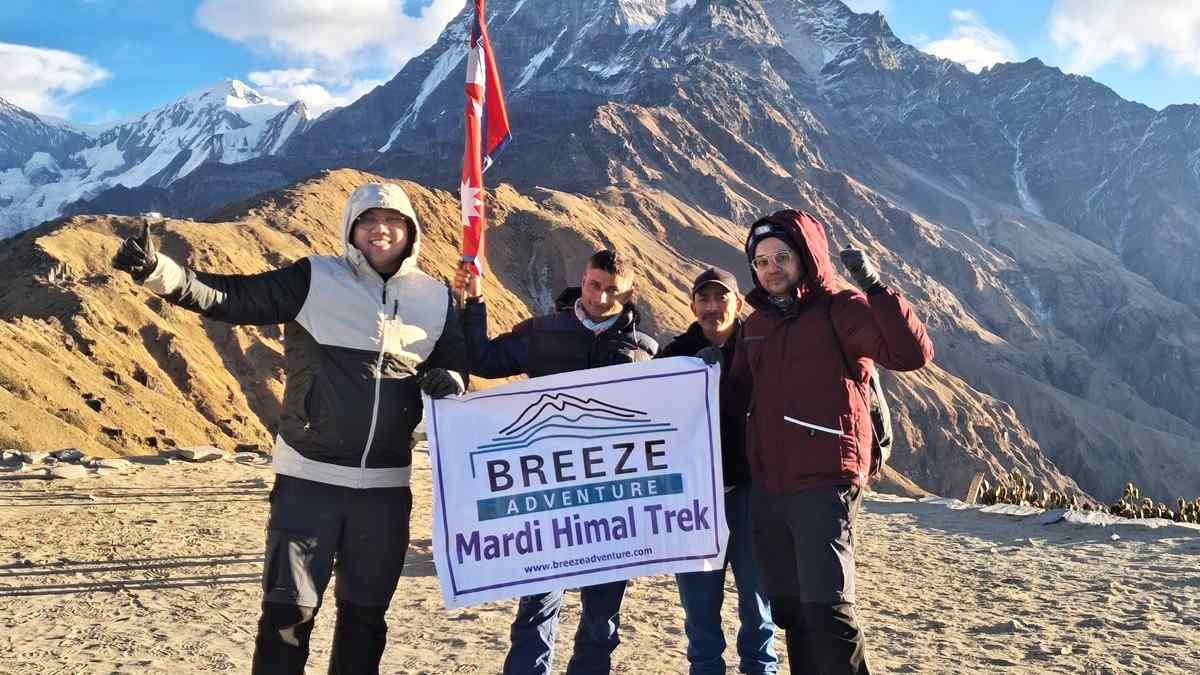 Breeze Adventure team holding company banner in Mardi Himal Trek